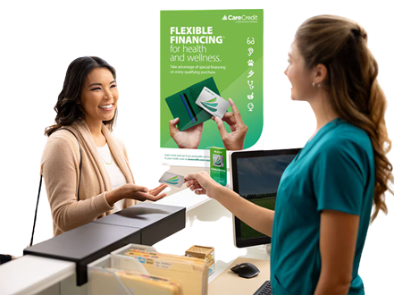 A dental patient and staff member discussing flexible payment options